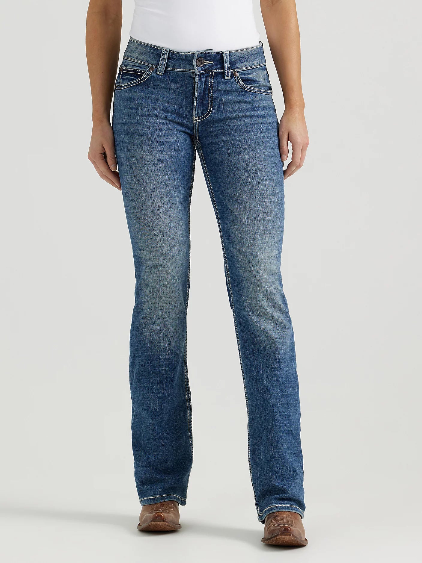 Person wearing blue jeans on a white background