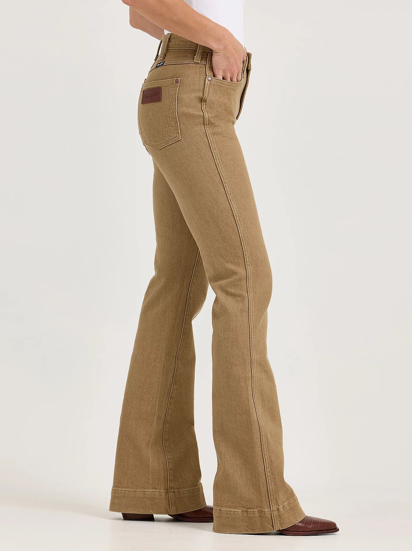 Tan bell-bottom pants on a white background