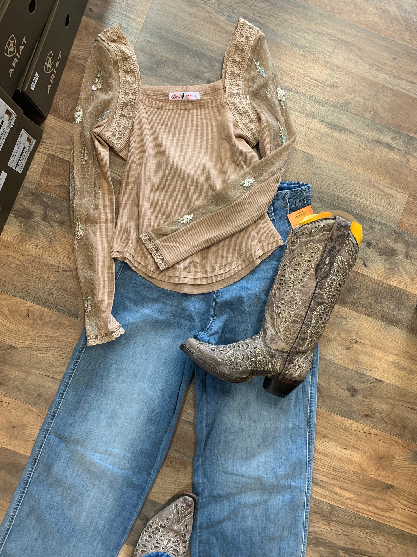 Floral gauze sleeves add a touch of delicate femininity