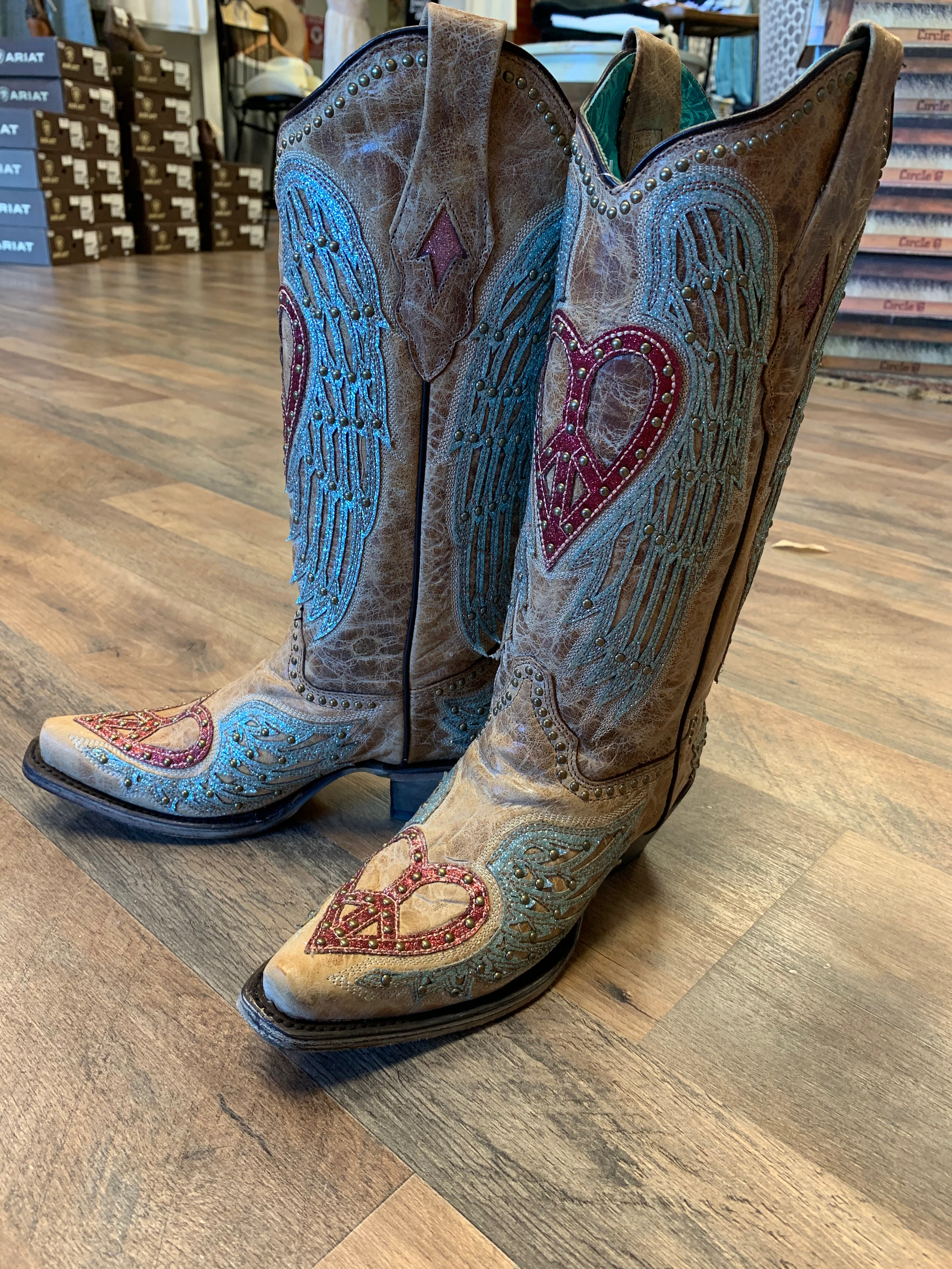 Corral boots with 2025 hearts and wings