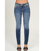 Blue jeans worn by a person on a white background