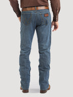 Person wearing blue jeans and a brown shirt on a white background