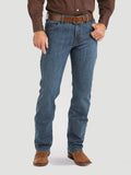 Person wearing blue jeans and brown shoes on a white background
