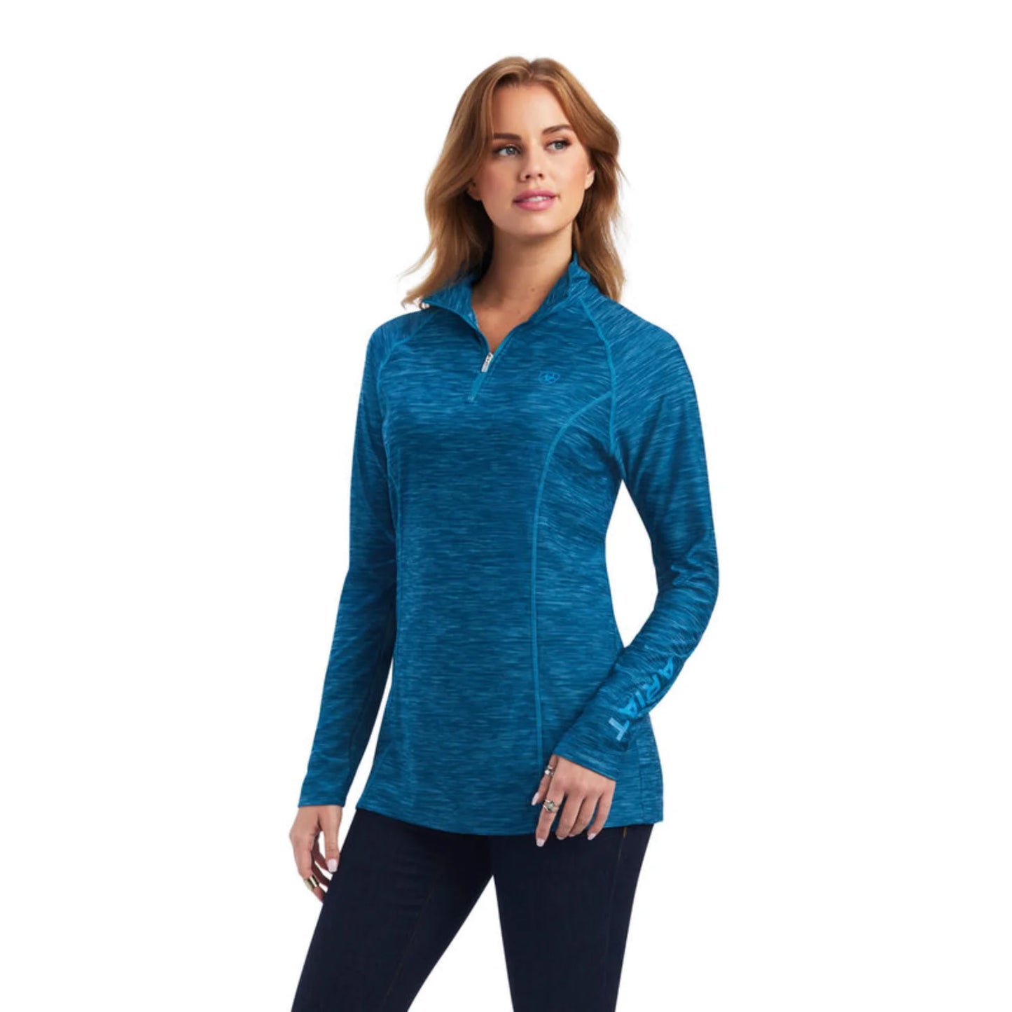 Woman wearing a blue long-sleeve athletic top on a white background