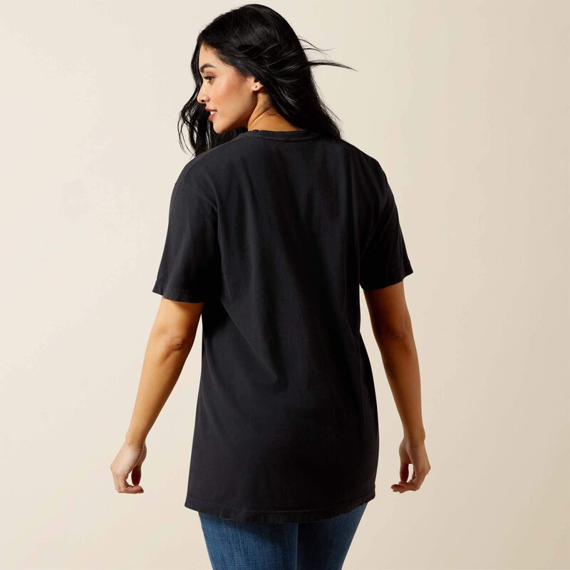 Woman wearing a black t-shirt on a beige background