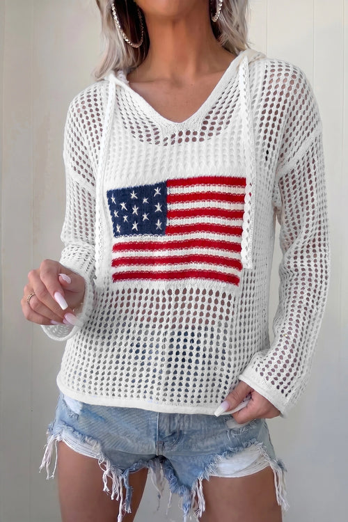 Person wearing a white mesh sweater with an American flag design.