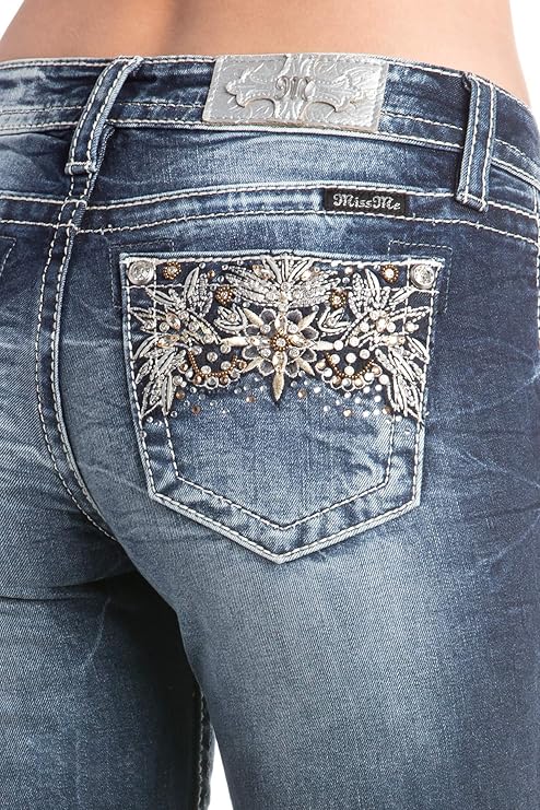 Close-up of blue jeans with decorative back pocket and brand logo.