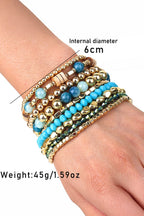 Stack of beaded bracelets on a wrist with measurements and weight displayed.