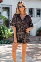 Woman wearing a leopard print romper in an outdoor setting