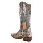 Cowboy boot with snake skin pattern on a white background