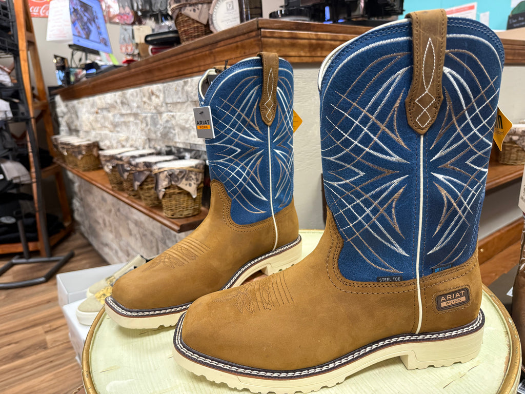 Pair of brown and blue cowboy boots on display in a store.