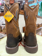 Pair of brown work boots with a UTurn tag on a light surface.