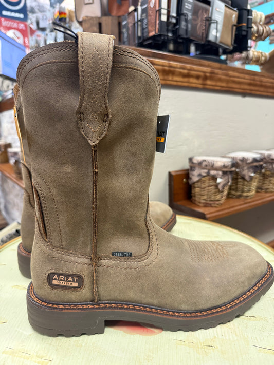 Brown Ariat boots on a display with a store interior background
