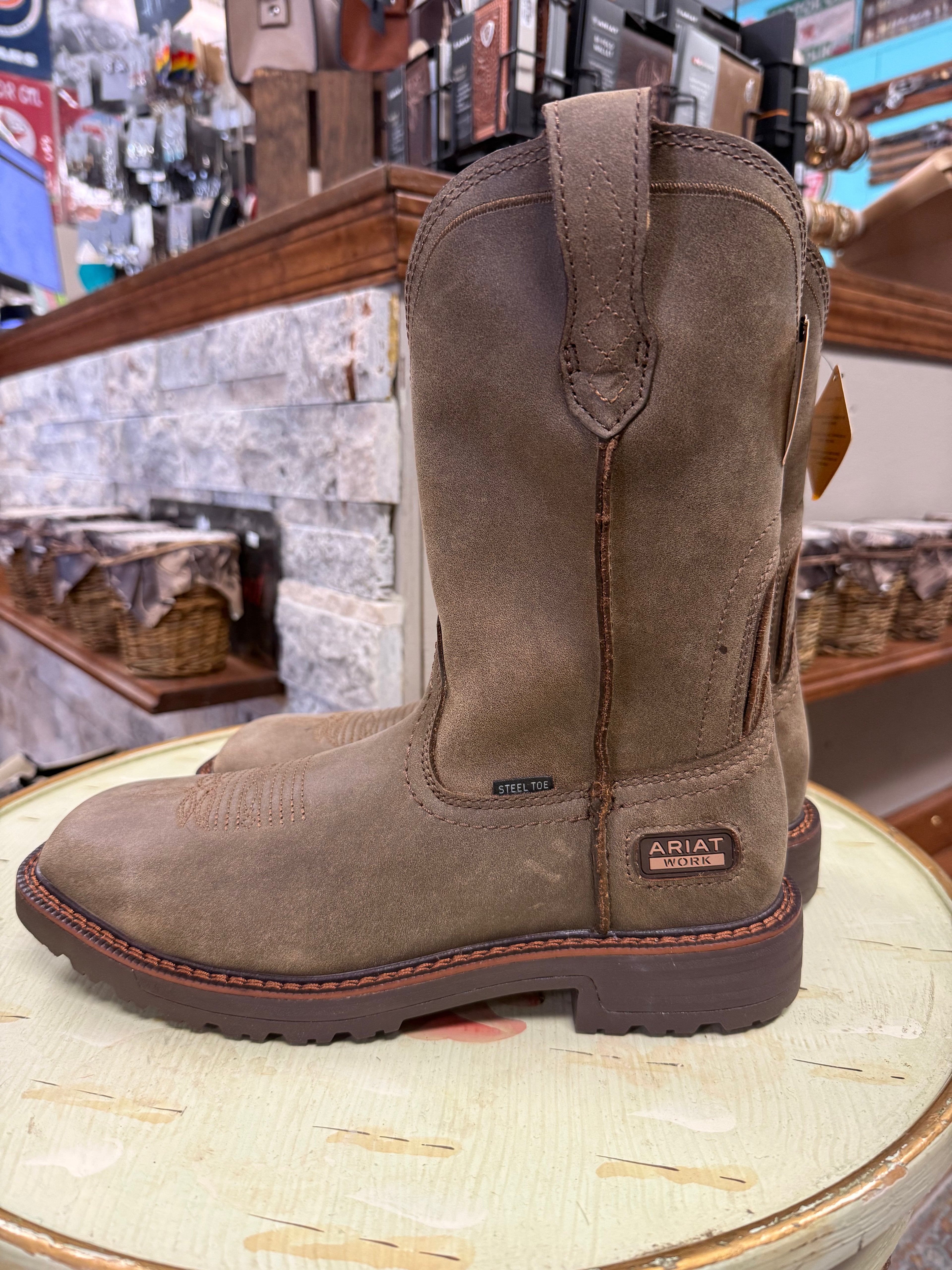 Brown work boot on a wooden surface with a store interior background