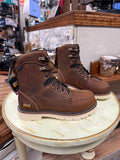 Pair of brown Ariat boots on a wooden stool in a store setting