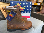 Brown work boots with a tag in front of a Patriotic American flag display.