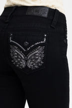 Black jeans with decorative back pocket and brand logo on a white background