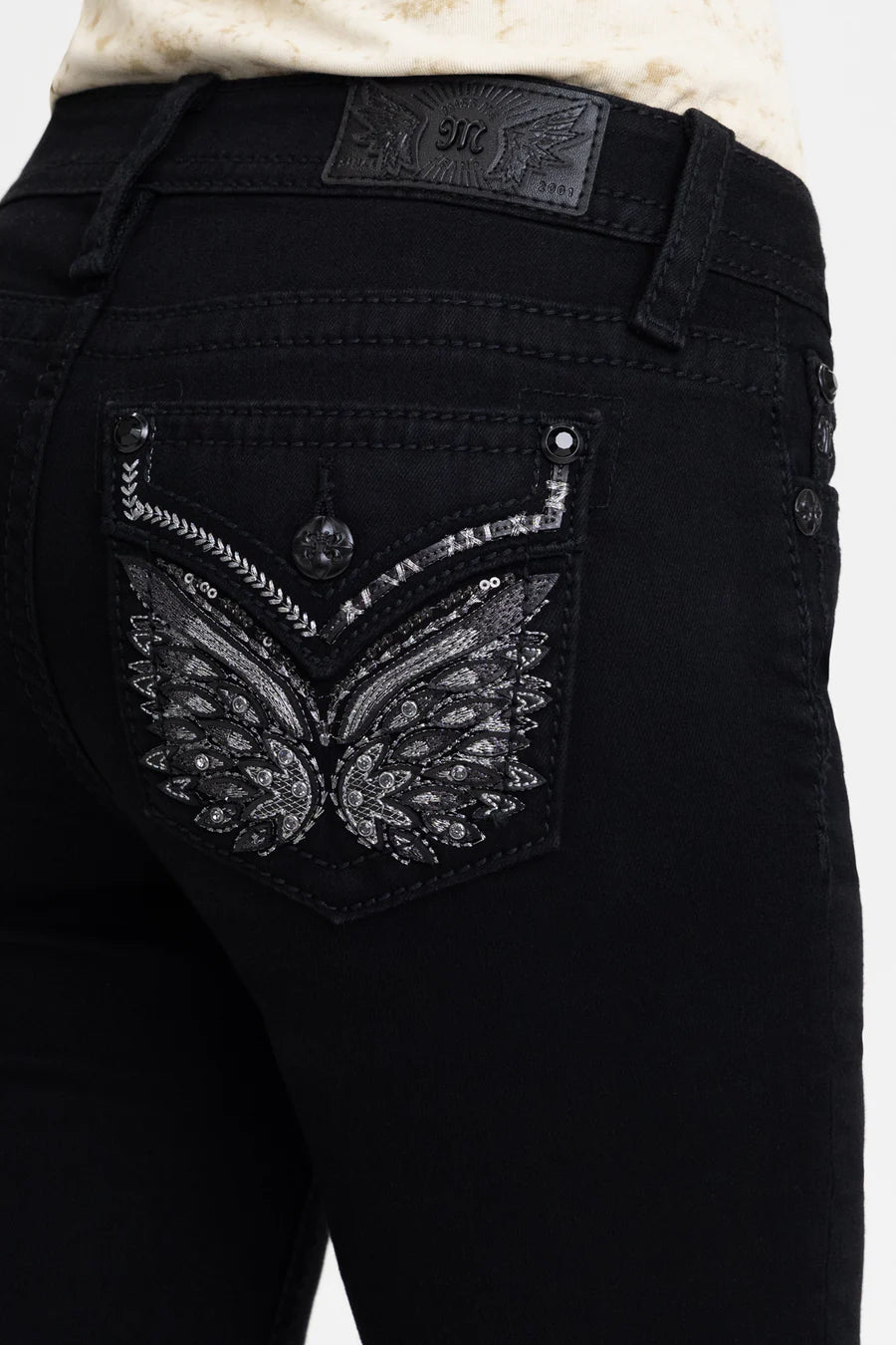 Black jeans with decorative back pocket and brand logo on a white background