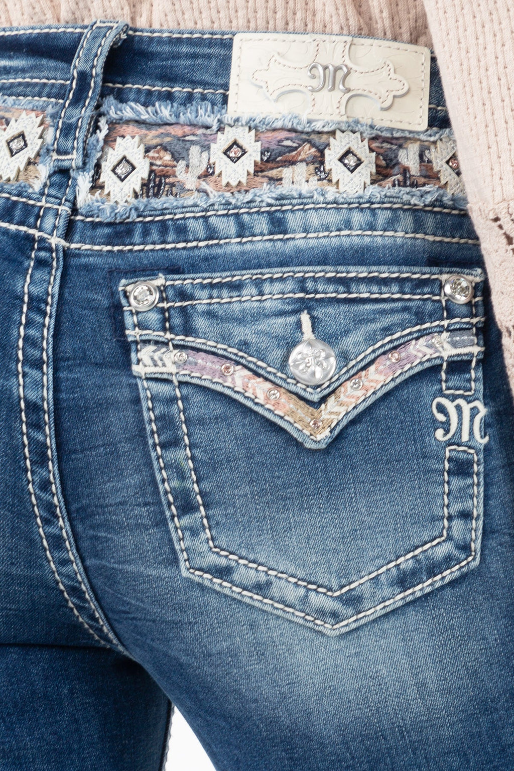Aztec print on yoke and a faux flap pocket design.