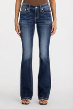 Blue jeans worn by a person on a white background