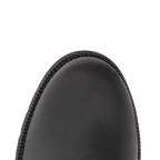 Close-up of the rounded toe of a black leather boot against a solid white background.