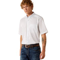Man wearing a white short-sleeve shirt and blue jeans on a white background