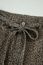 Leopard print pants with a tie waist on a white background