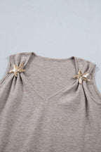 Gray sleeveless top with starfish designs on a light blue background